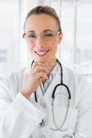 Smiling female doctor with stethoscope in hospital