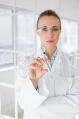 Female doctor holding an injection in hospital