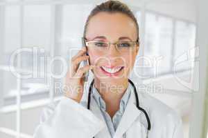 Closeup of a female doctor using mobile phone