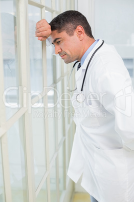 Side view of a thoughtful male doctor