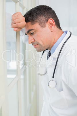 Side view of a thoughtful male doctor