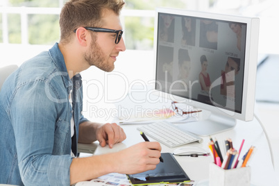 Handsome editor working with digitizer