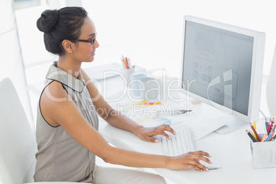 Designer working at her desk using computer