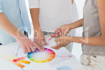 Interior designer showing colour wheel to customers