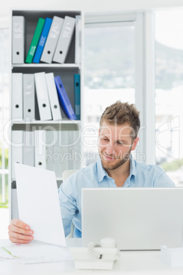 Handsome man working at his desk