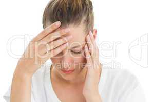 Woman having a headache with her head in her hands