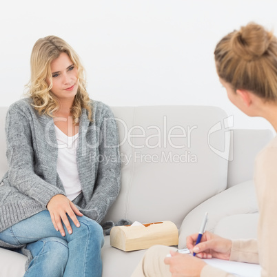 Blonde woman listening to her therapist