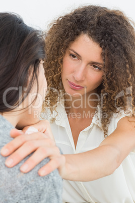 Therapist comforting her crying patient