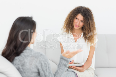 Therapist listening to her talking patient