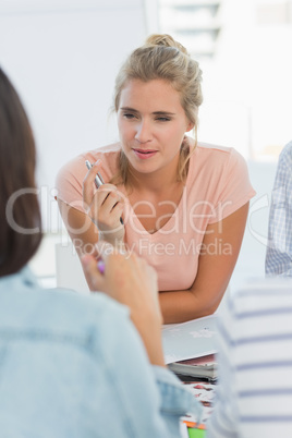 Smiling design team talking at a meeting