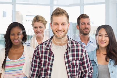 Diverse design team standing and smiling at camera