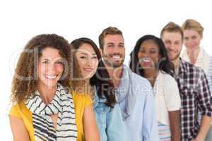 Happy group of young friends standing in a row