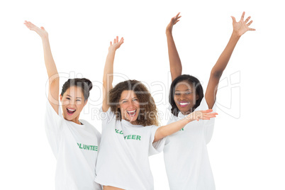 Attractive team of volunteers waving at camera