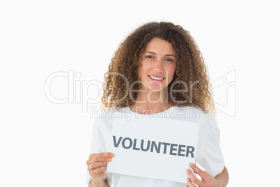 Happy volunteer showing a poster