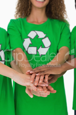 Team of environmental activists putting hands together