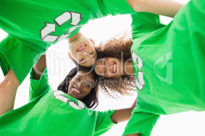 Environmental activists embracing and looking down at camera