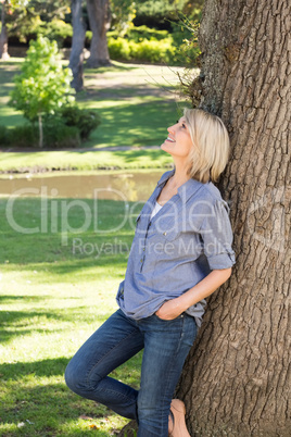 Thoughtful woman in park