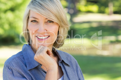 Portrait of happy woman in park