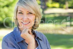 Portrait of happy woman in park