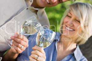 Couple toasting wine glasses
