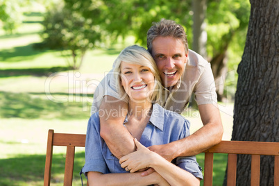 Man embracing woman from behind