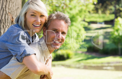 Couple enjoying piggyback ride