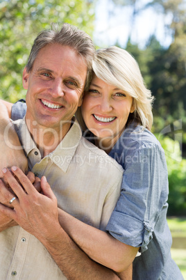 Couple embracing in park