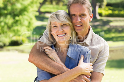 Man embracing woman from behind