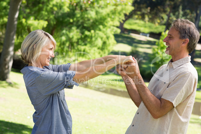 Romantic couple dancing in park