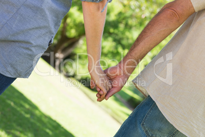 Romantic couple holding hands Romantic couple holding hands
