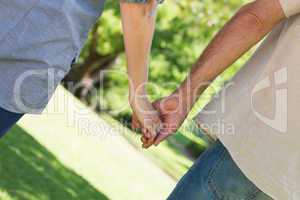 Romantic couple holding hands