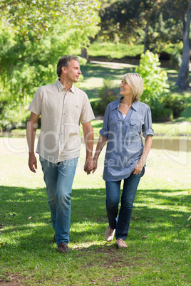 Romantic couple walking in park