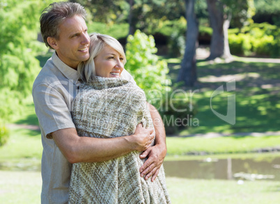 Loving couple embracing in park