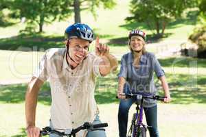 Couple enjoying bike ride in park
