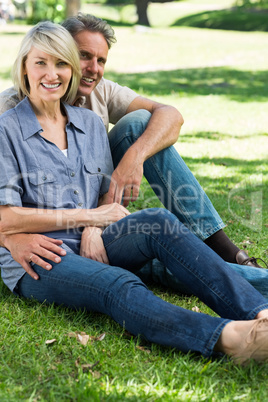 Loving couple relaxing in park