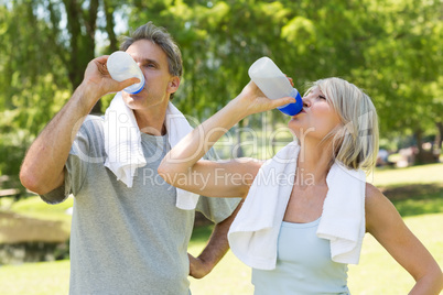 Couple drinking water after workout