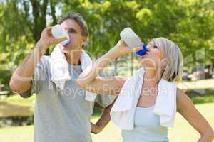 Couple drinking water after workout