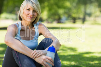 Woman with water bottle in park