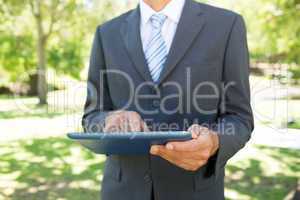 Businessman using digital tablet