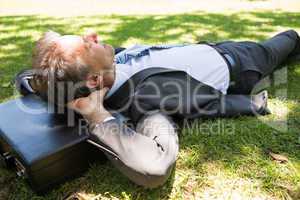 Businessman resting in park