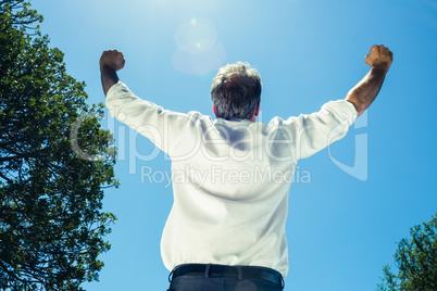 Businessman with arms outstretched