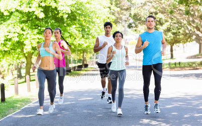 Marathon athletes running on street