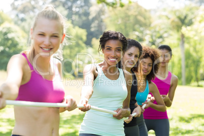 Women pulling a rope in tug of war