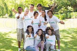 Confident volunteers raising thumbs up