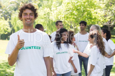 Confident volunteer showing thumbs up