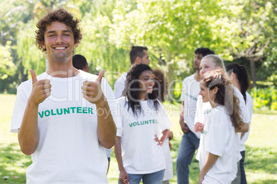 Happy volunteer gesturing thumbs up