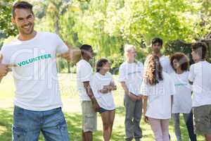 Handsome volunteer pointing at tshirt