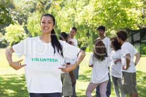 Happy female volunteer holding tshirt