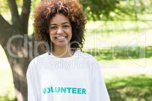 Confident female volunteer in park