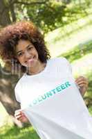 Environmentalist holding volunteer tshirt